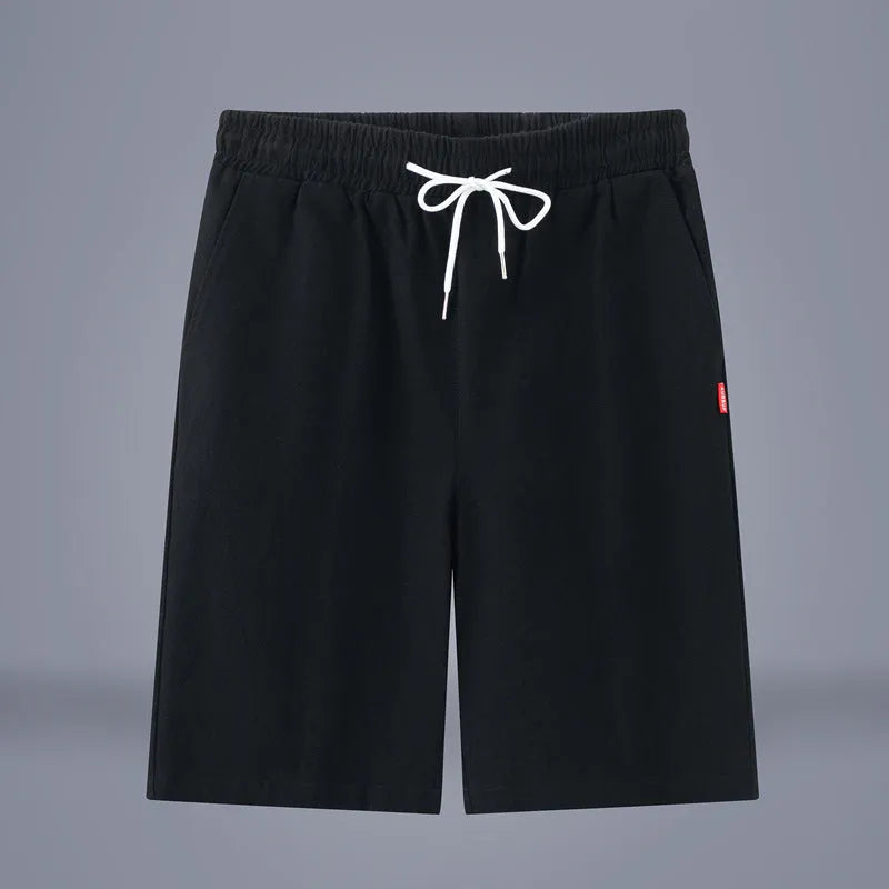 Solid colour cotton linen cropped summer pants with a drawstring waistband on a hanger.