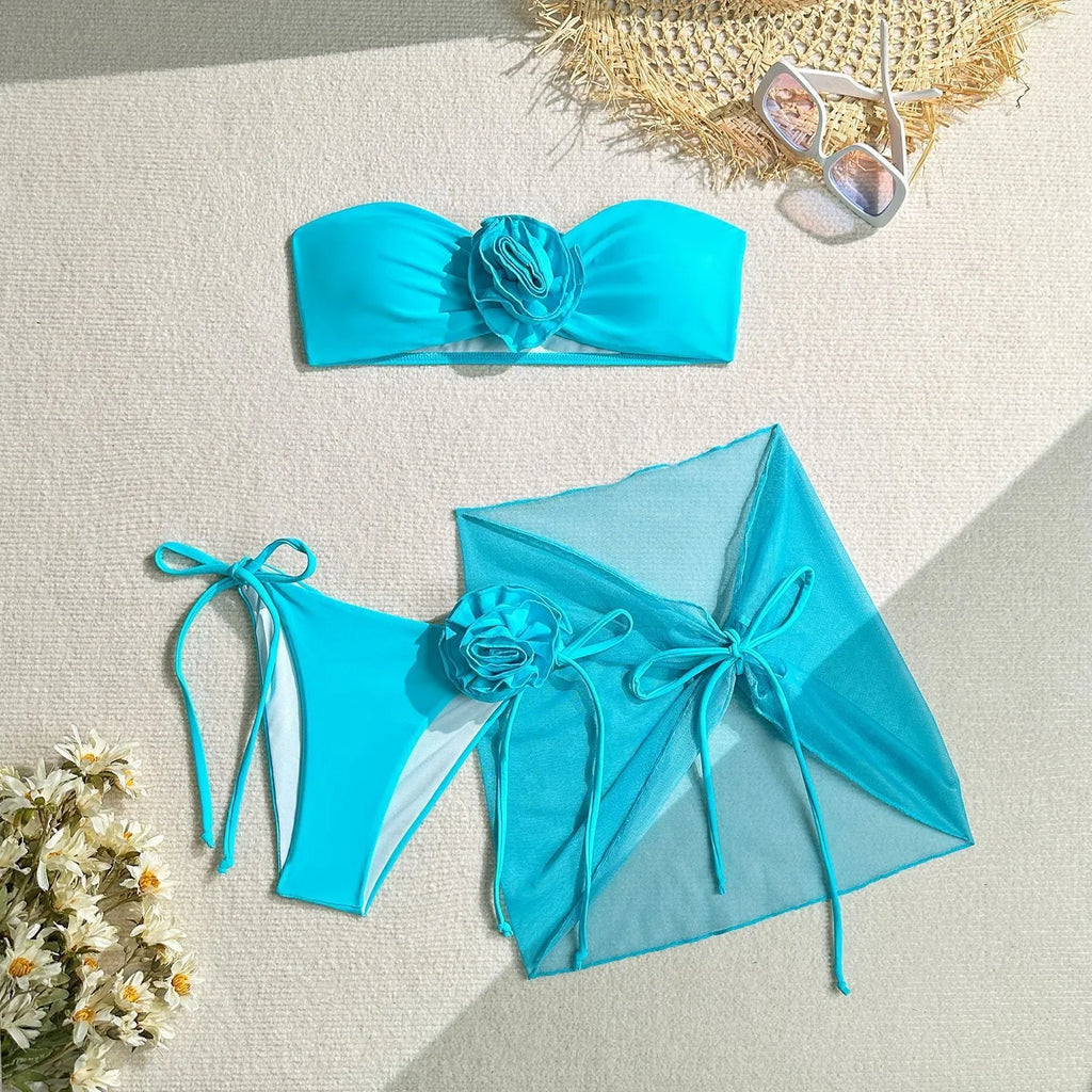 Women's blue tube top swimsuit with large 3D flower tie, matching pants and skirt