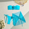 Women's blue tube top swimsuit with large 3D flower tie, matching pants and skirt