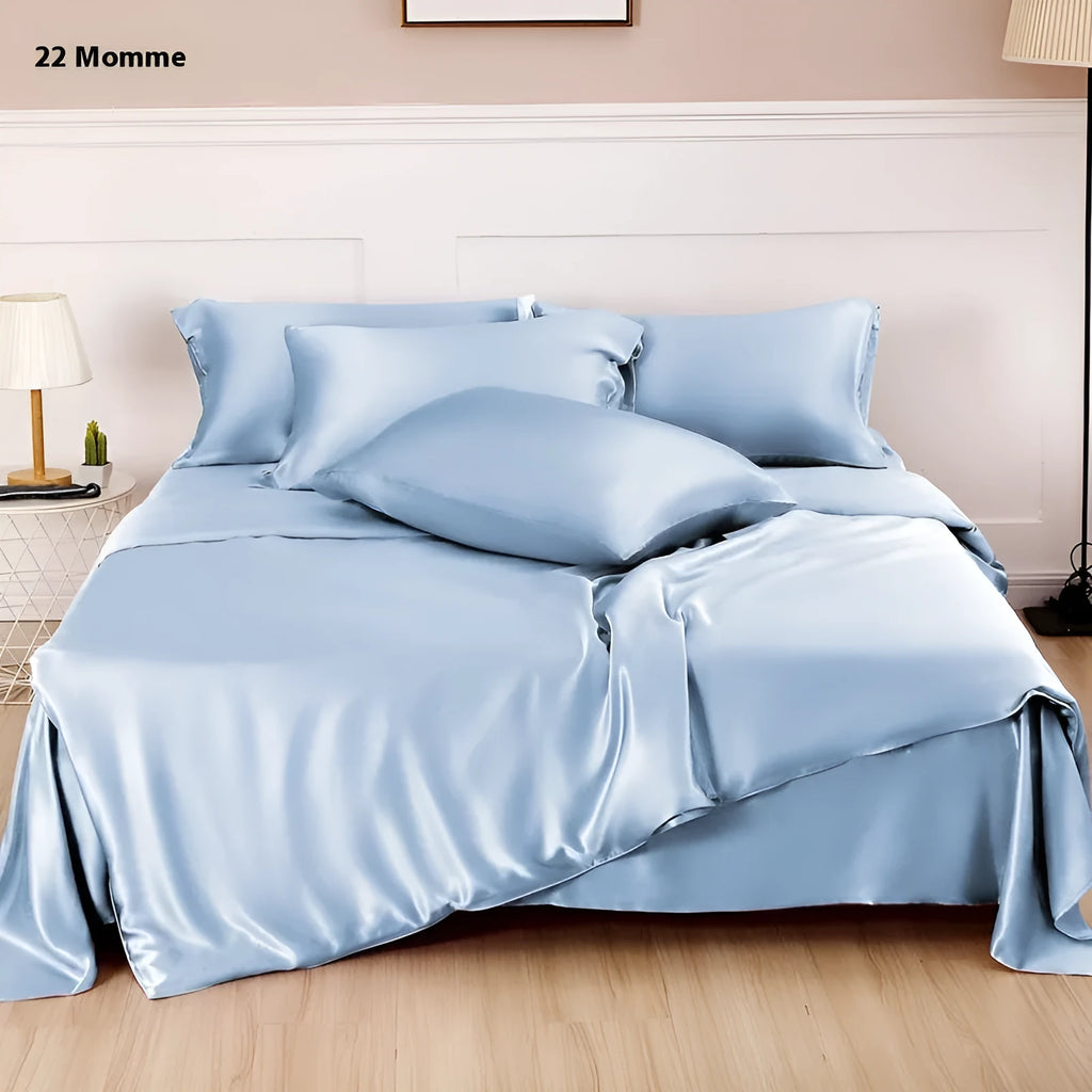 Pure silk duvet cover in a solid colour showing its sheen and texture, laid flat on a bed.