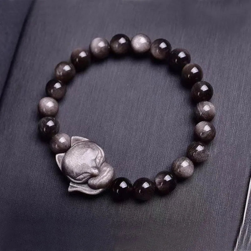 Obsidian stone bracelet with detailed fox charm on polished 8mm stone
