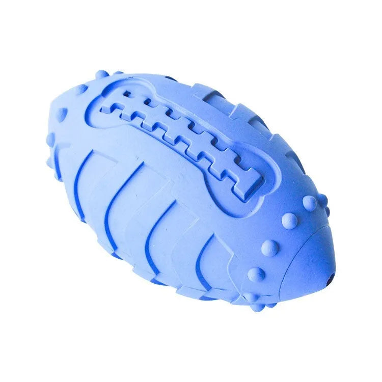 Light green rugby-shaped rubber dog toy with bite-resistant texture for chewing and interactive play