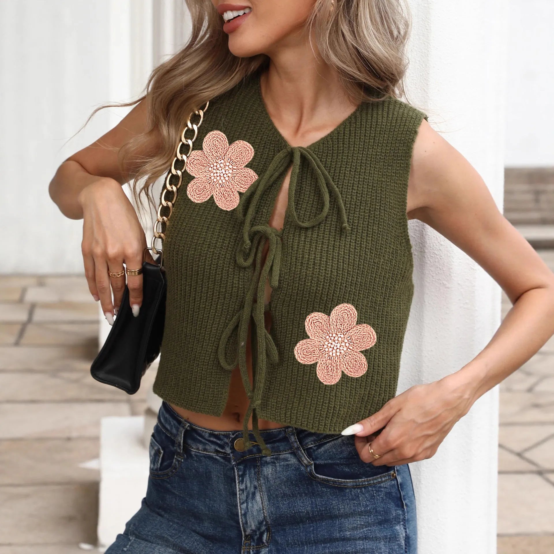 White women's lace-up vest top with bow tie and floral embroidery on sleeveless deer plush cardigan.