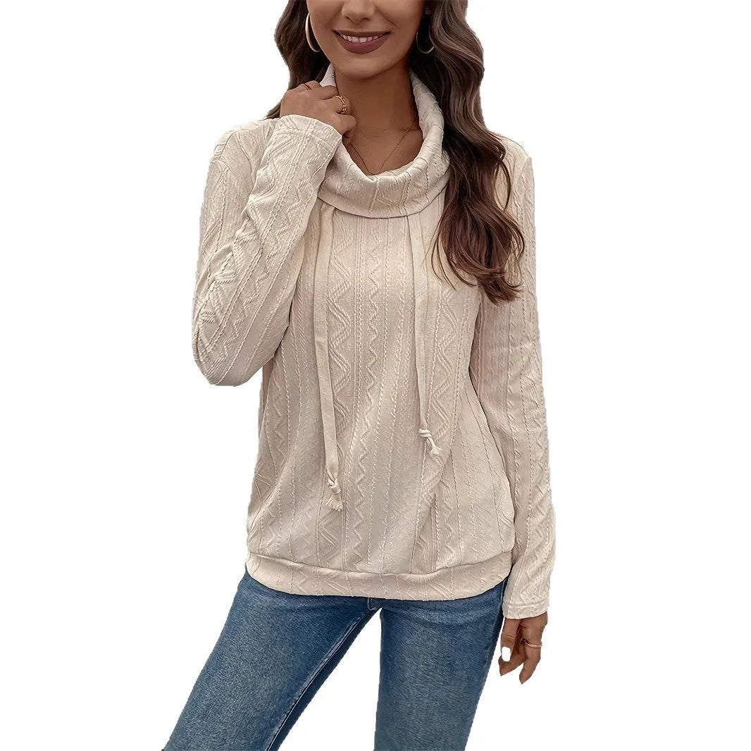 Apricot coloured long sleeve hooded pullover sweater on a hanger