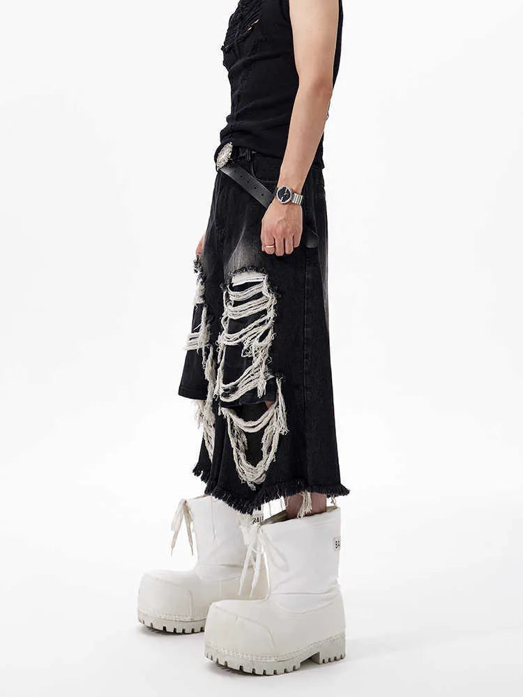 Black cropped wide leg jeans with ripped patch details and mid-high waist