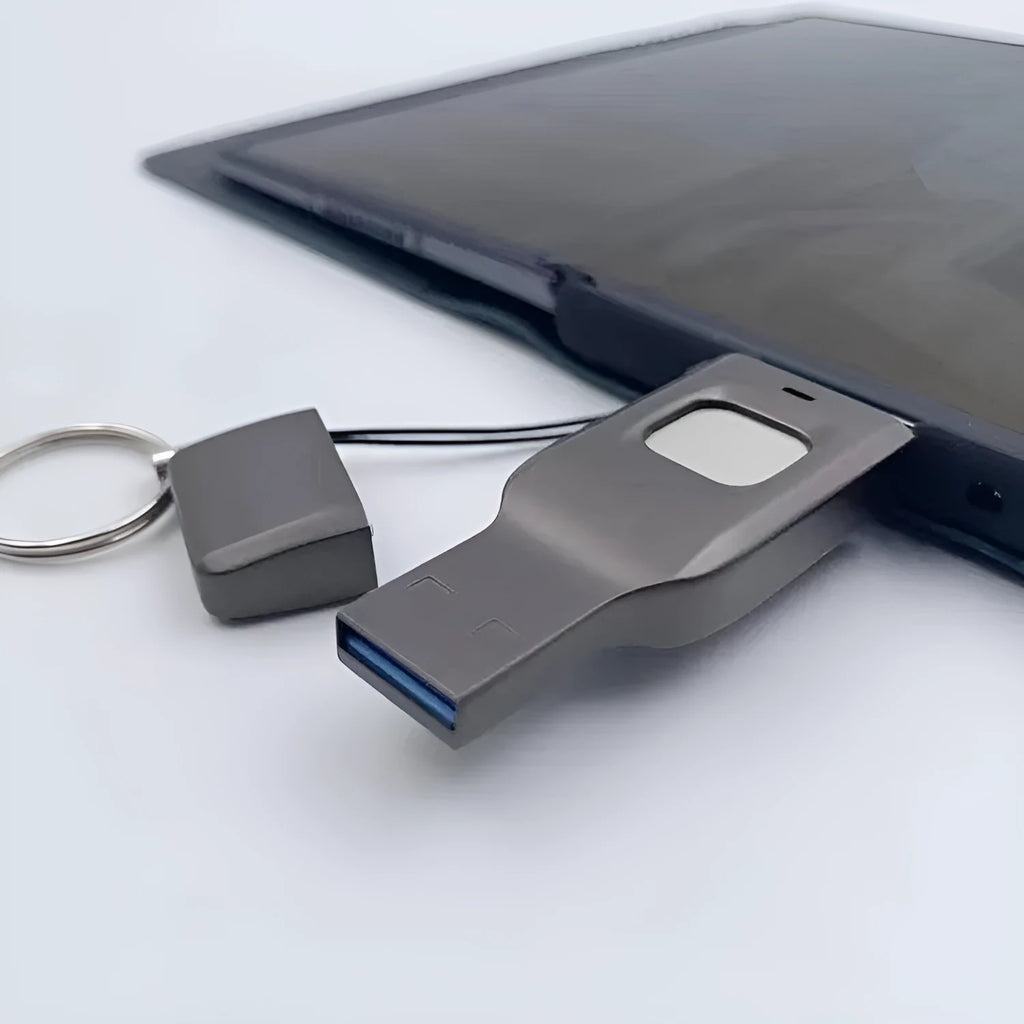 Black encrypted USB flash drive with fingerprint sensor showing USB 3.0 and USB-C connectors