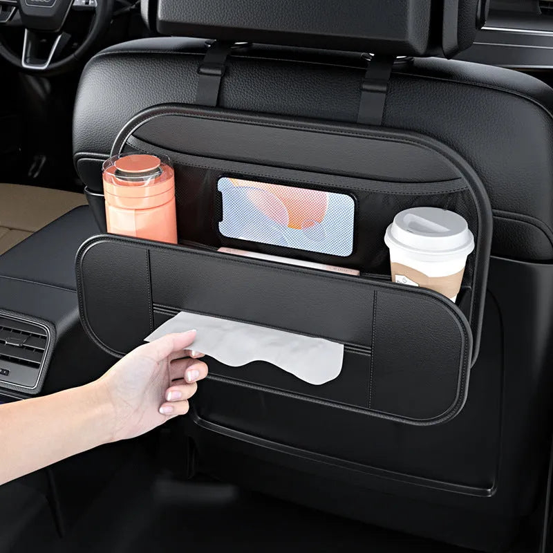 Black leather car seat back storage bag with mesh pockets for phones and bottles.