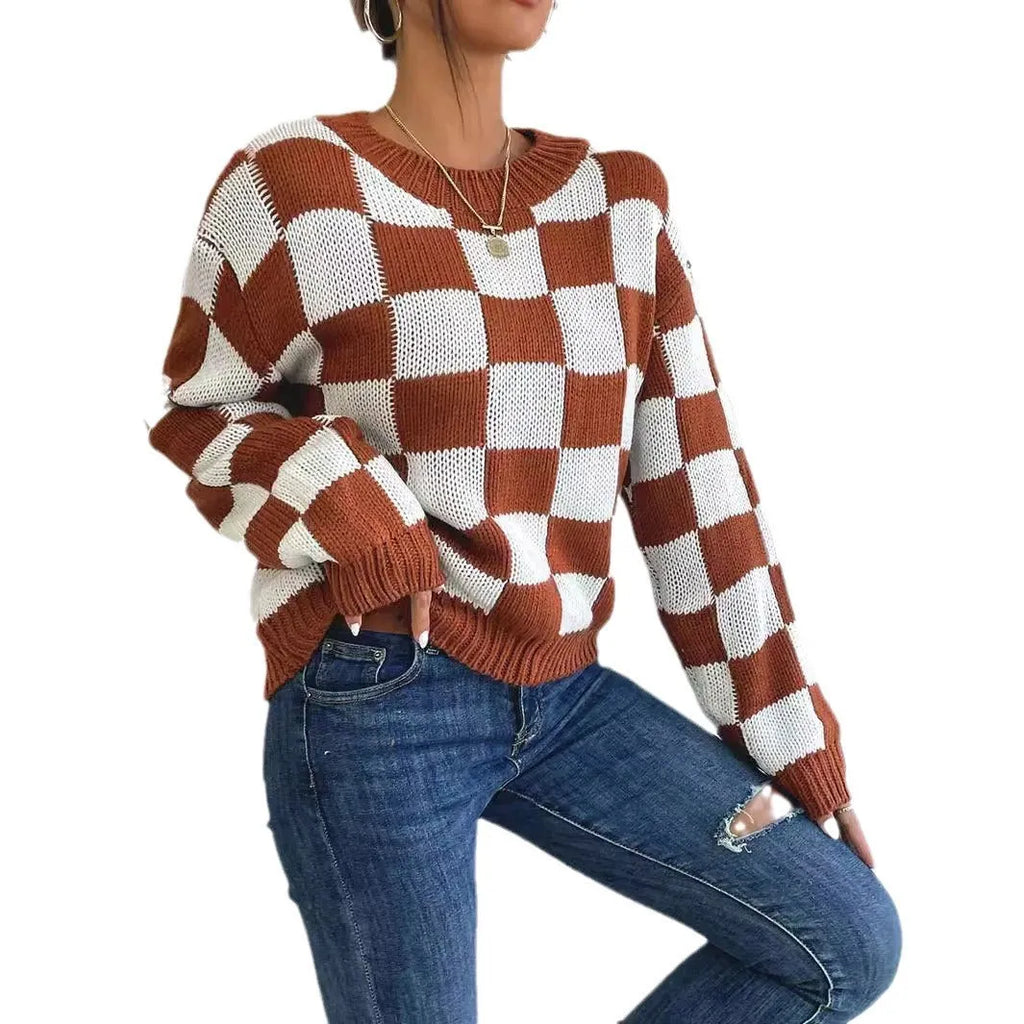Dark brown loose plaid pullover sweater with long sleeves and a round neck.