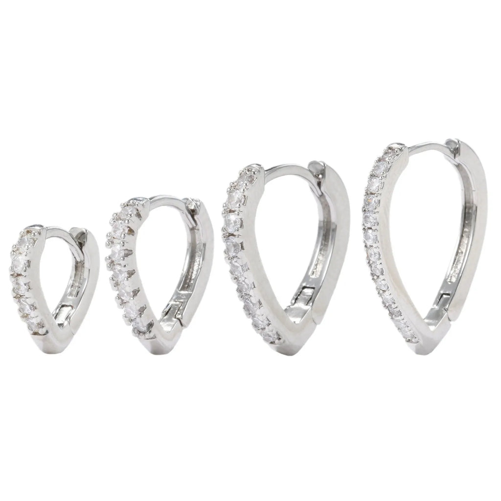 A geometric heart-shaped copper ear clip with a gold or white electroplated finish.