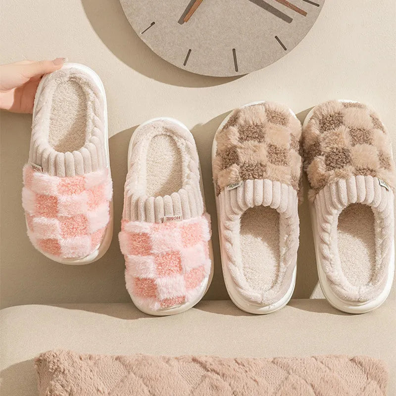 Plaid patterned women's indoor slippers in various colours with a soft sole and plush interior.