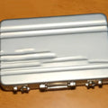 Aluminium alloy card holder in six colour options showing red, blue, black, silver, pink, and gold finishes