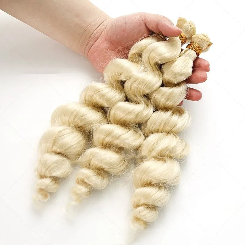 Golden synthetic hair weft wig showing long, straight strands in a golden yellow colour.