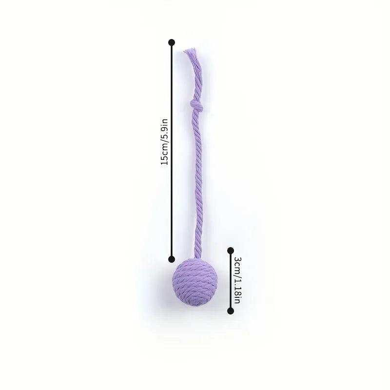 Colourful cat toy ball with an attached rope and an internal bell, shown in green, pink, purple and yellow.