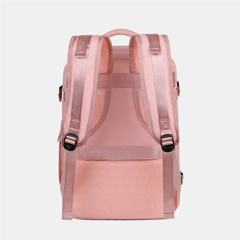 Large purple travel backpack for women with laptop compartment and organisational pockets.