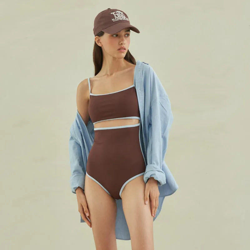 Brown women's triangle one-piece swimsuit on a hanger, sizes M L XL available.
