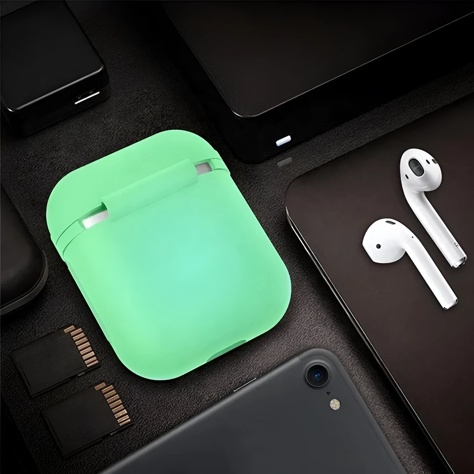 Luminous solid colour silicone flip case for Apple AirPods wireless earphones.