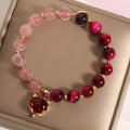 Strawberry crystal bead bracelet on elastic rope measuring 18cm with simple design