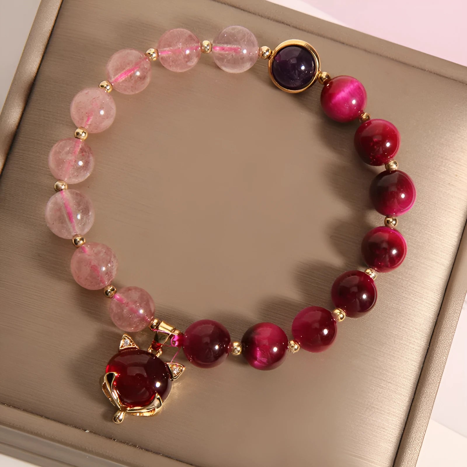 Strawberry crystal bead bracelet on elastic rope measuring 18cm with simple design
