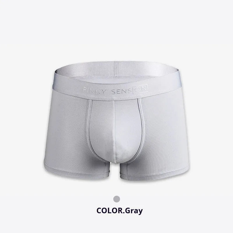 Men's solid colour cotton boxer shorts in black, shown flat