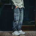 Men's blue loose straight-leg stretch denim casual trousers on a plain background