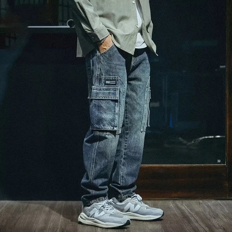 Men's blue loose straight-leg stretch denim casual trousers on a plain background