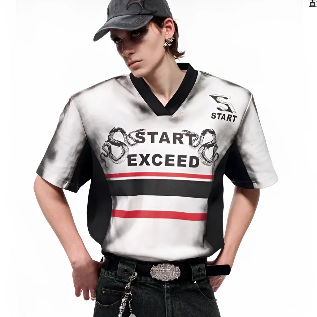 V-neck short sleeve top with padded shoulders featuring letter snake pattern print