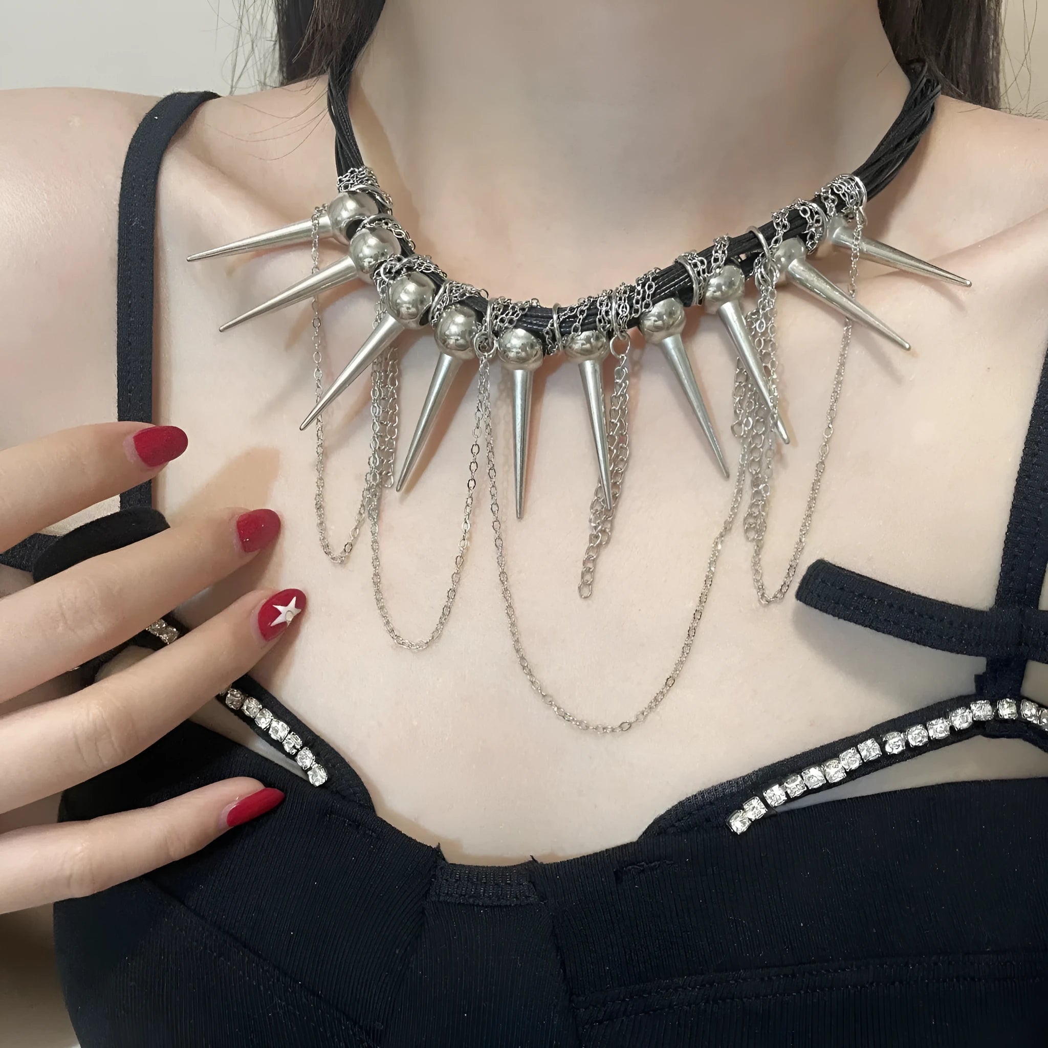 Women's leather tassel necklace with winding beads and silver rivet details in picture colour.