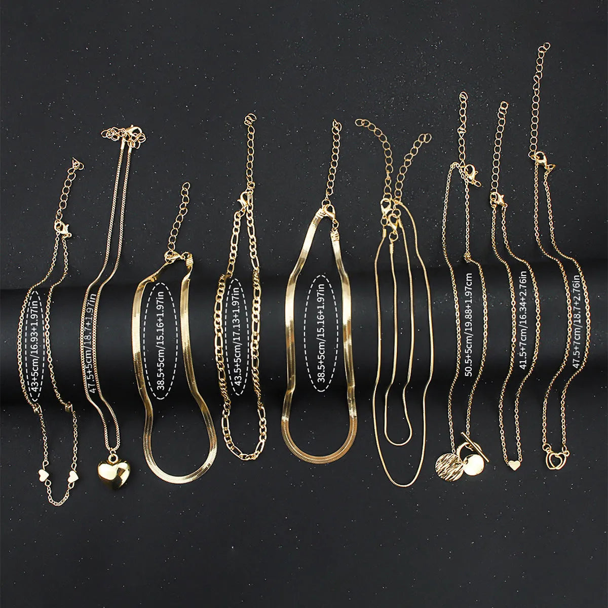 Gold electroplated women's necklace set with 10 alloy pendant pieces on snake bones chains