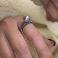 Geometric copper women's ring with adjustable opening and a black pearl detail.