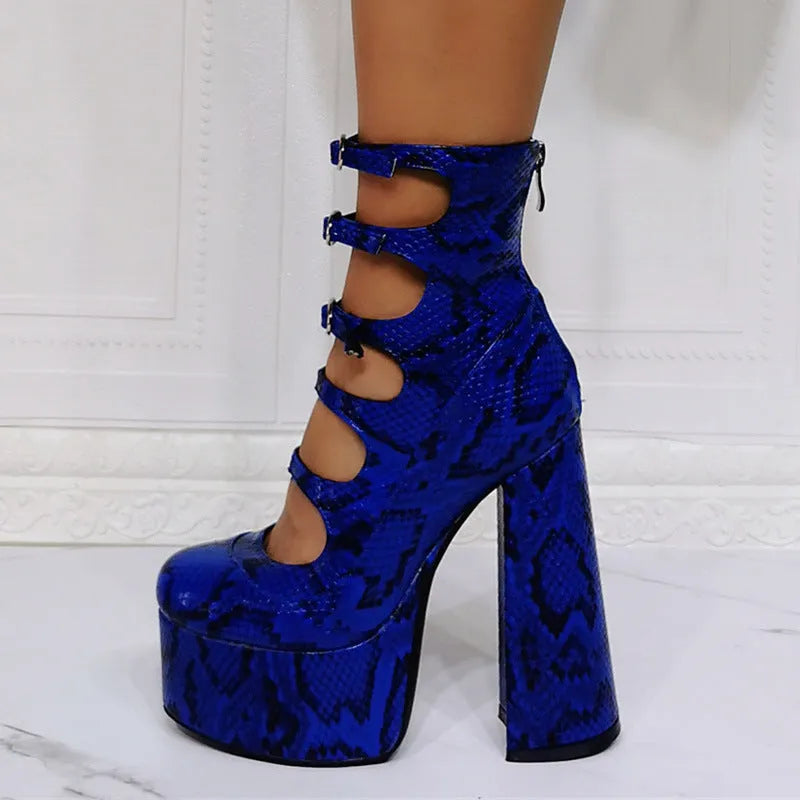 Women's black platform high heels with a thick heel, patent leather upper, and a serpentine design buckle.