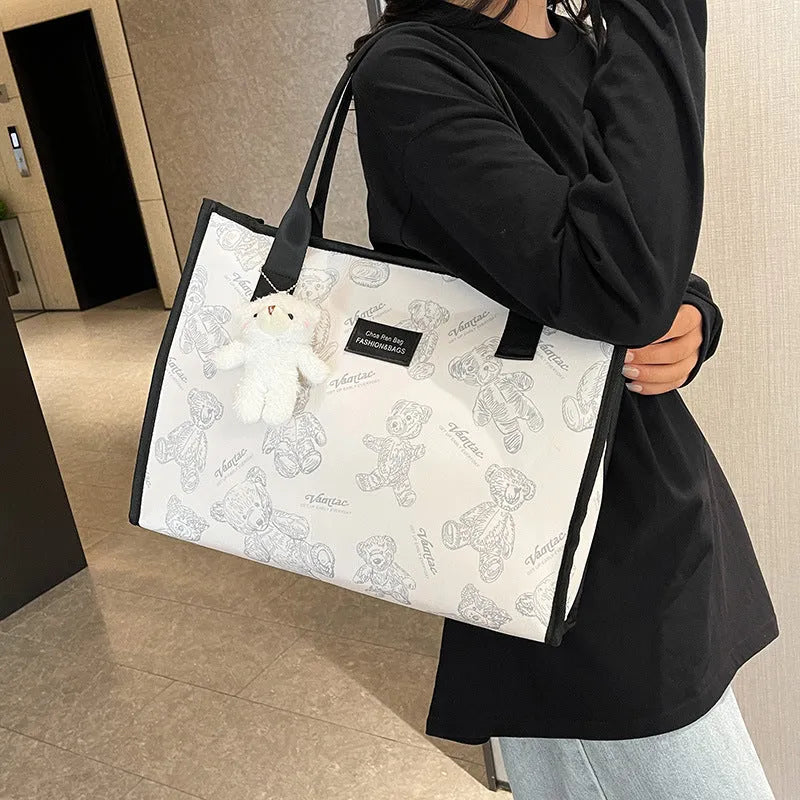 Women's printed canvas tote bag with sandwich pocket and horizontal square shape