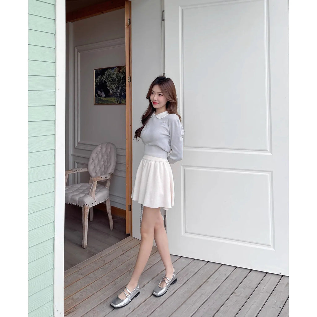 Silver women's Mary Jane shoes with cross buckle strap and flat heel