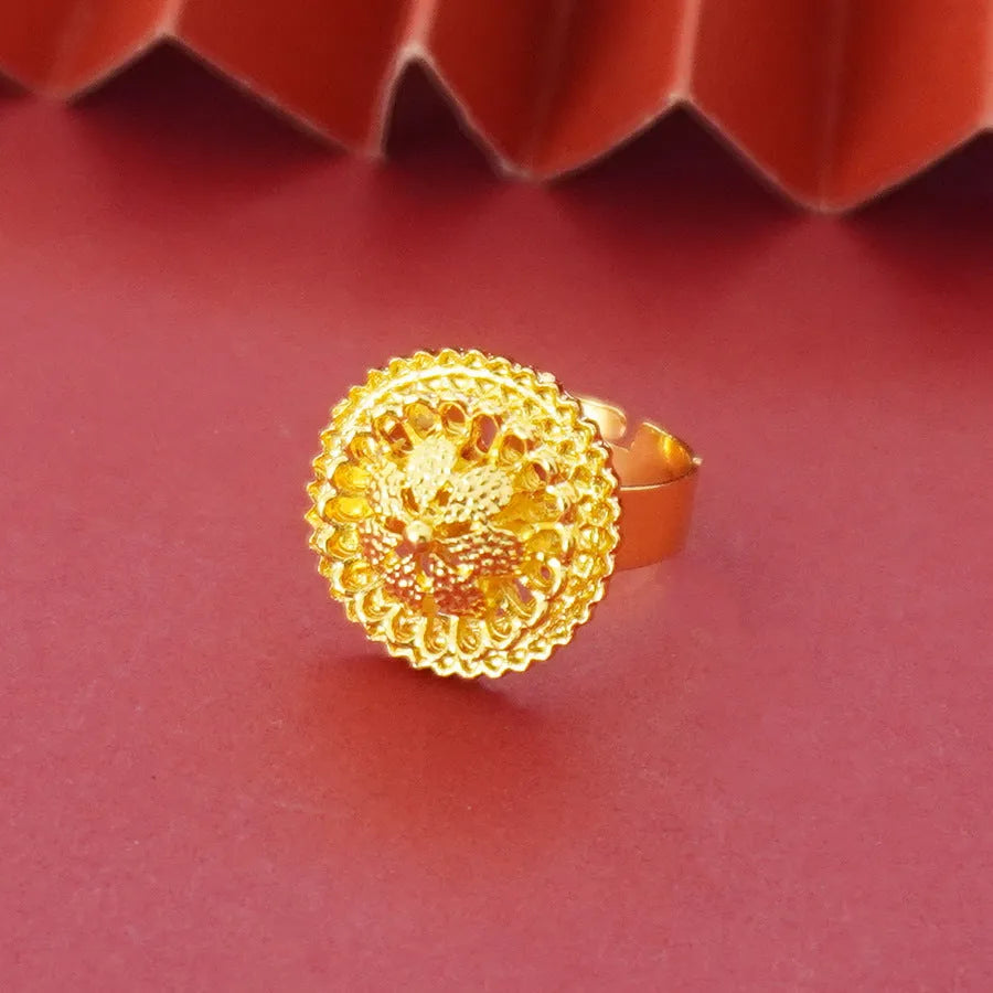 Gold-plated three-piece jewellery set showing necklace with floral pendant, matching earrings, and ring on a water wave chain.