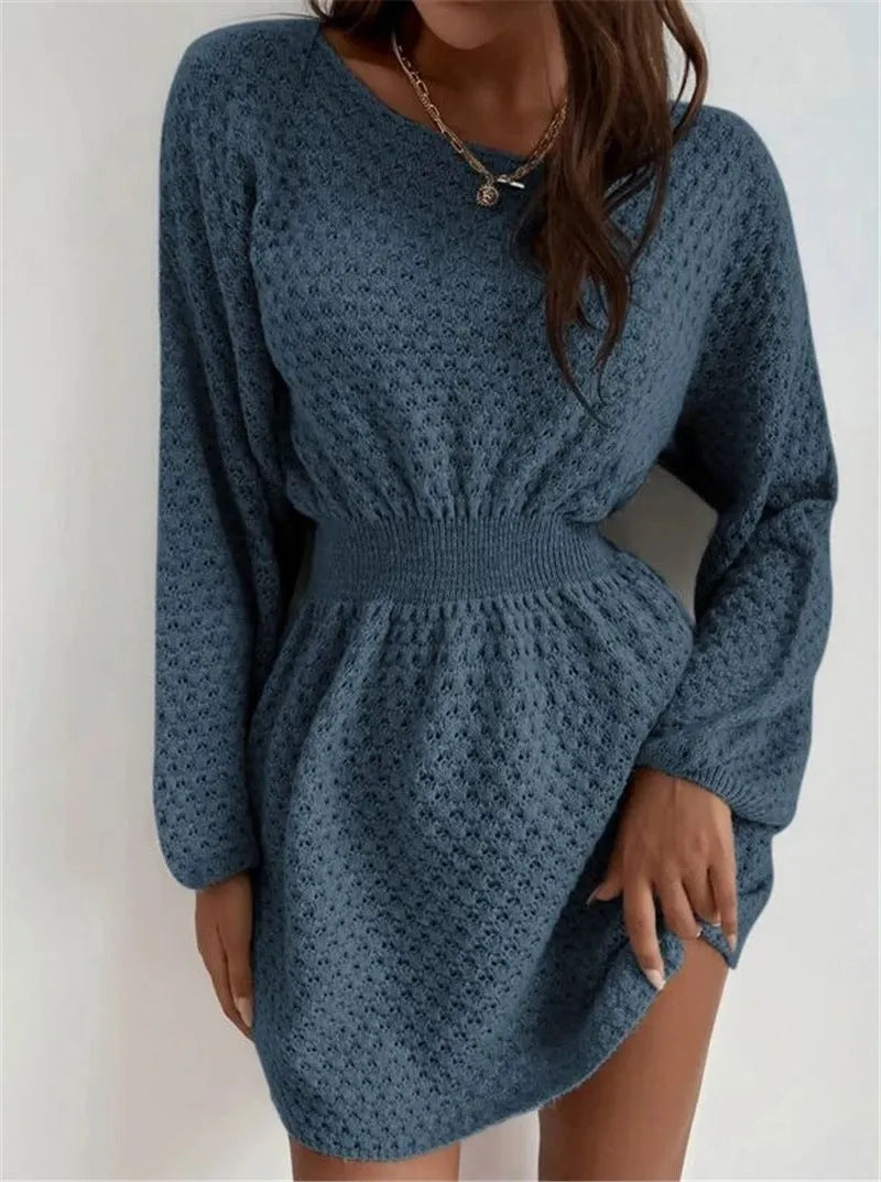 Blue women's knitted dress with crochet flower detail, round neck, and fitted waist