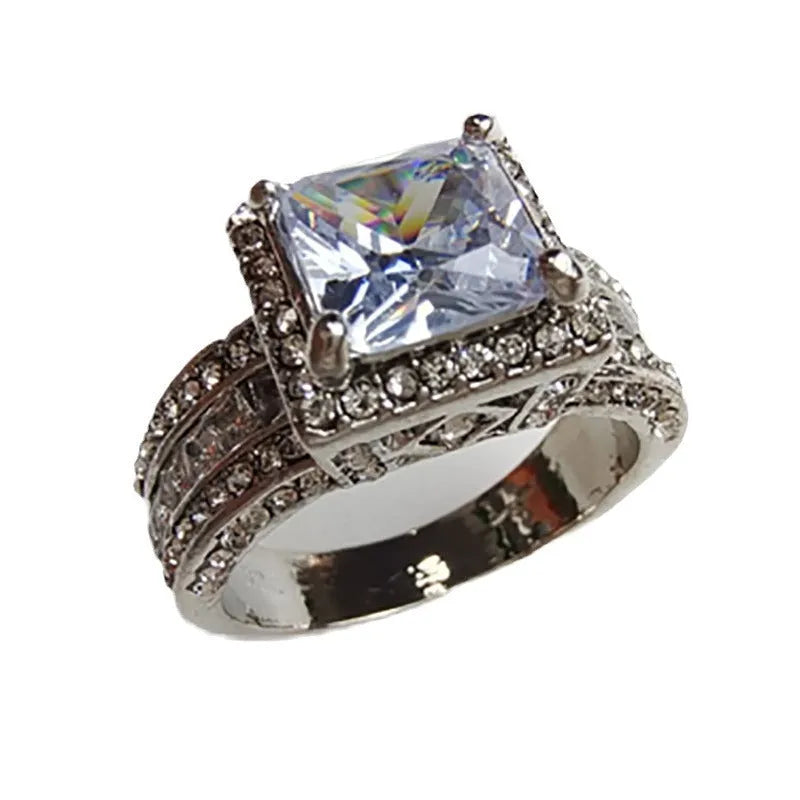 Electroplated alloy women's geometric engagement ring in gold or white colour on size display