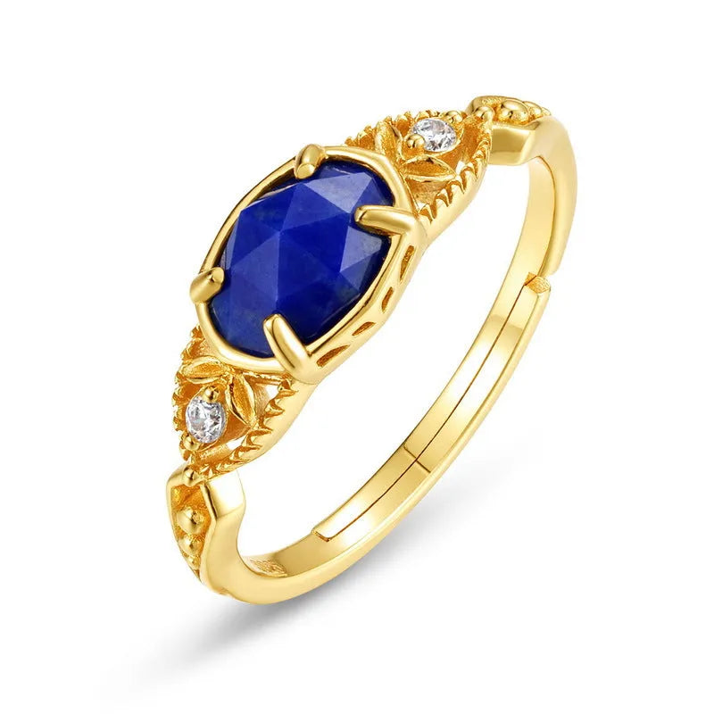 Japanese style silver alloy ring with elliptical geometric shape and blue lapis lazuli stone.