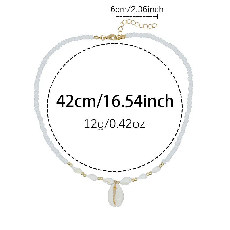 White conch shell mother-of-pearl pendant necklace on a silver electroplated chain for women.
