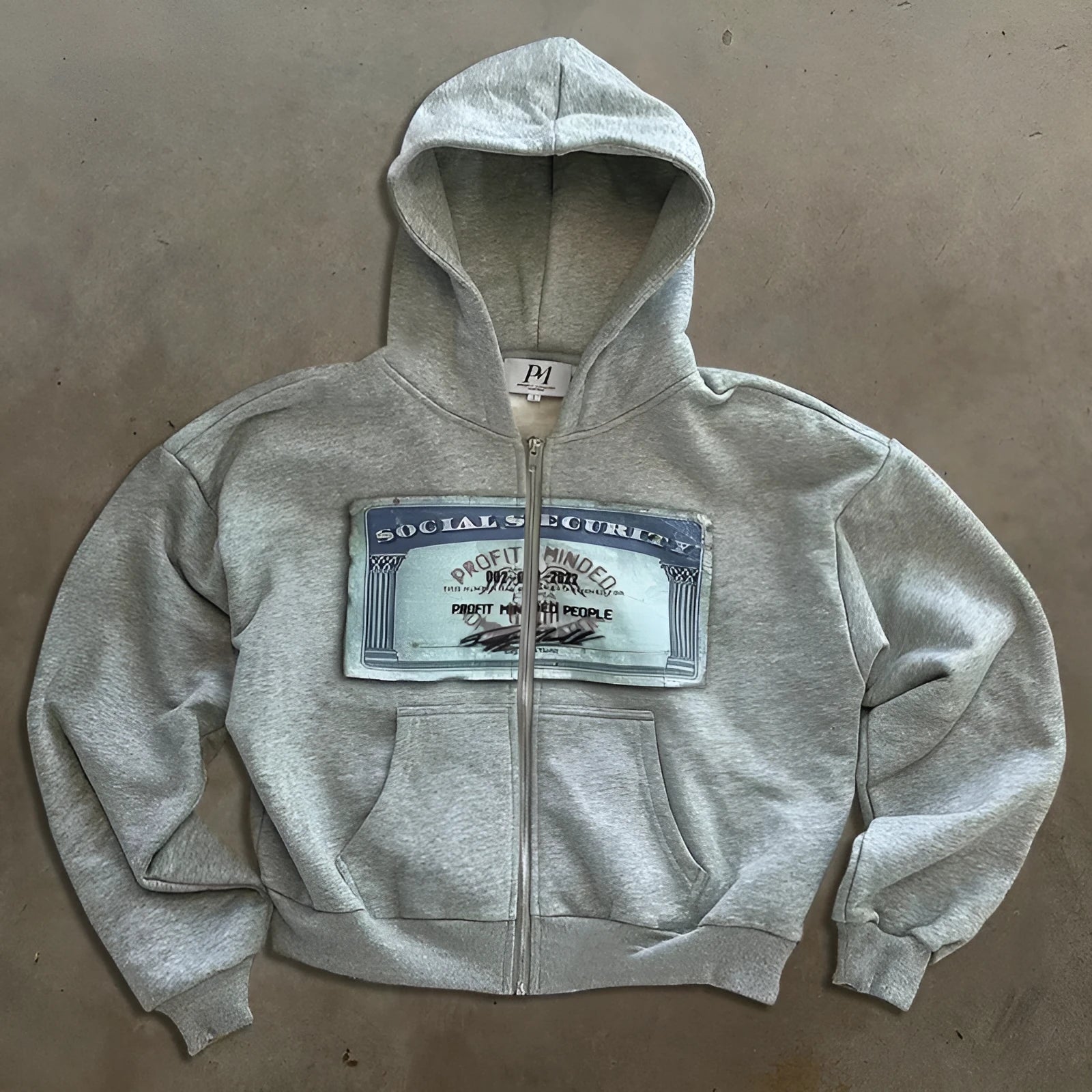 Men's and women's loose fit hoodie jacket with zippered pockets in polyester fabric