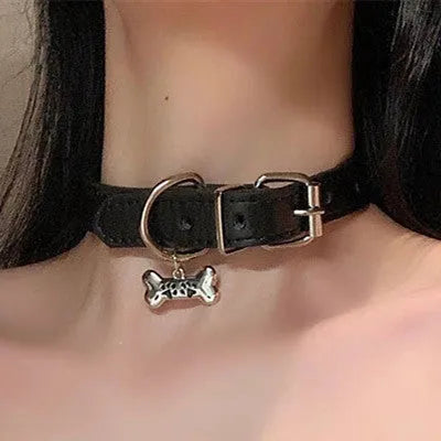 Black adjustable dog collar showing LD leather, bone, and cat paw design options.