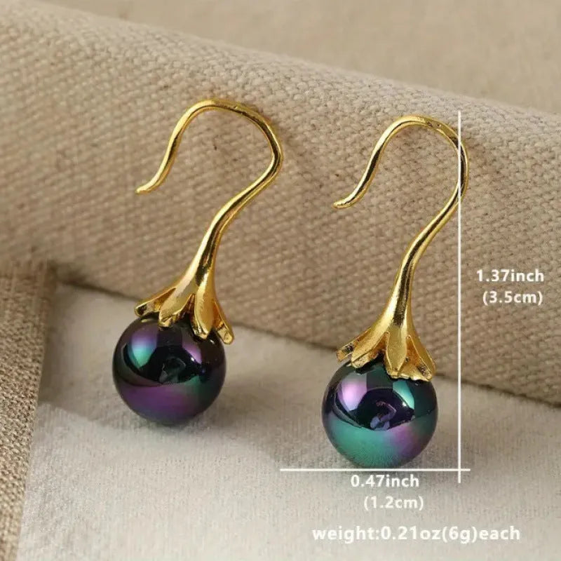 Women's retro fashion earrings with electroplated gold finish and dangly drop design