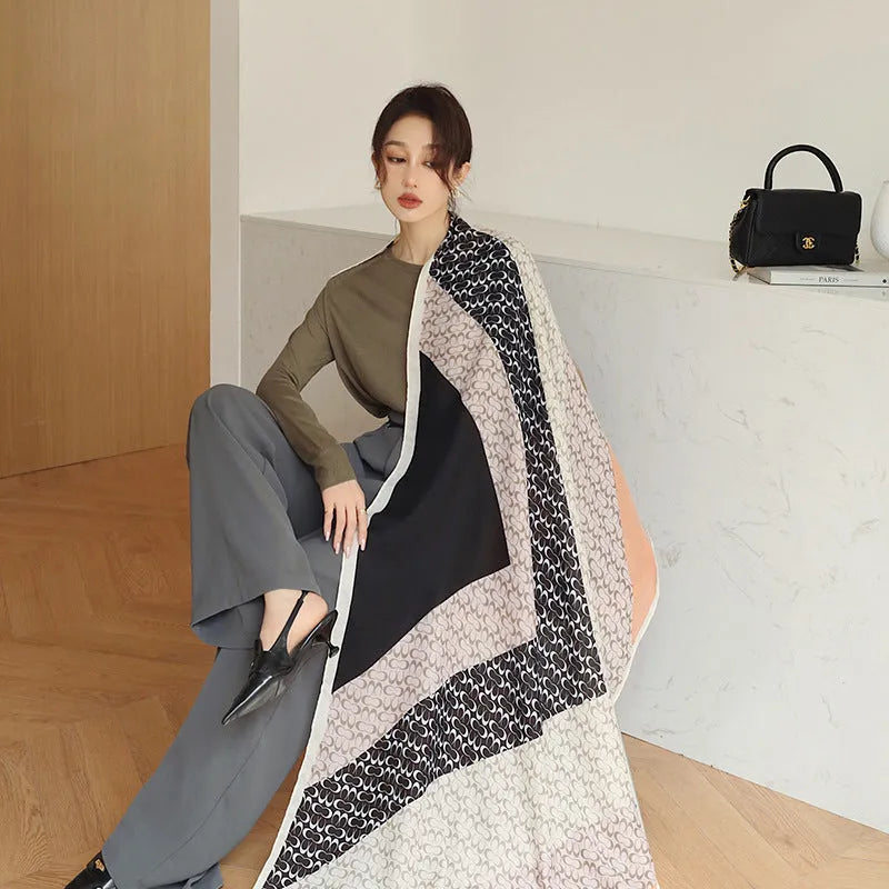 Women's printed polyester scarf showing decorative pattern and mid-length dimensions for autumn wear