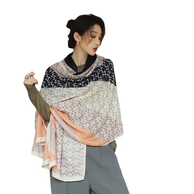 Women's printed polyester scarf showing decorative pattern and mid-length dimensions for autumn wear
