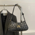 Women's casual PU leather shoulder bag in black with sandwich pocket, 27cm length