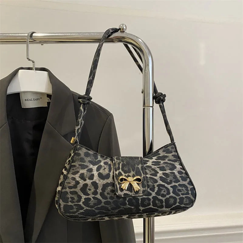Women's casual PU leather shoulder bag in black with sandwich pocket, 27cm length