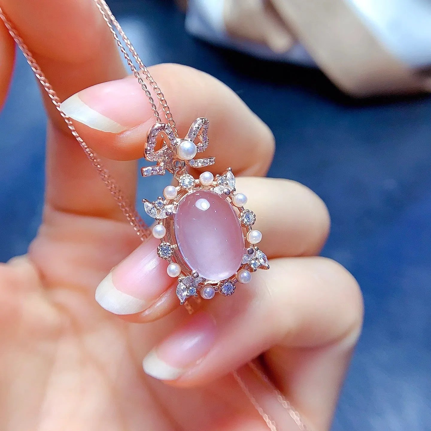 Geometric silver pendant with rose quartz stone and rose gold plating on an alloy chain