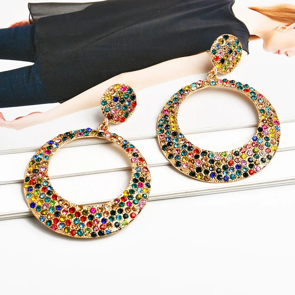 A pair of colourful cartoon style alloy earrings with large round pendant drops for women.