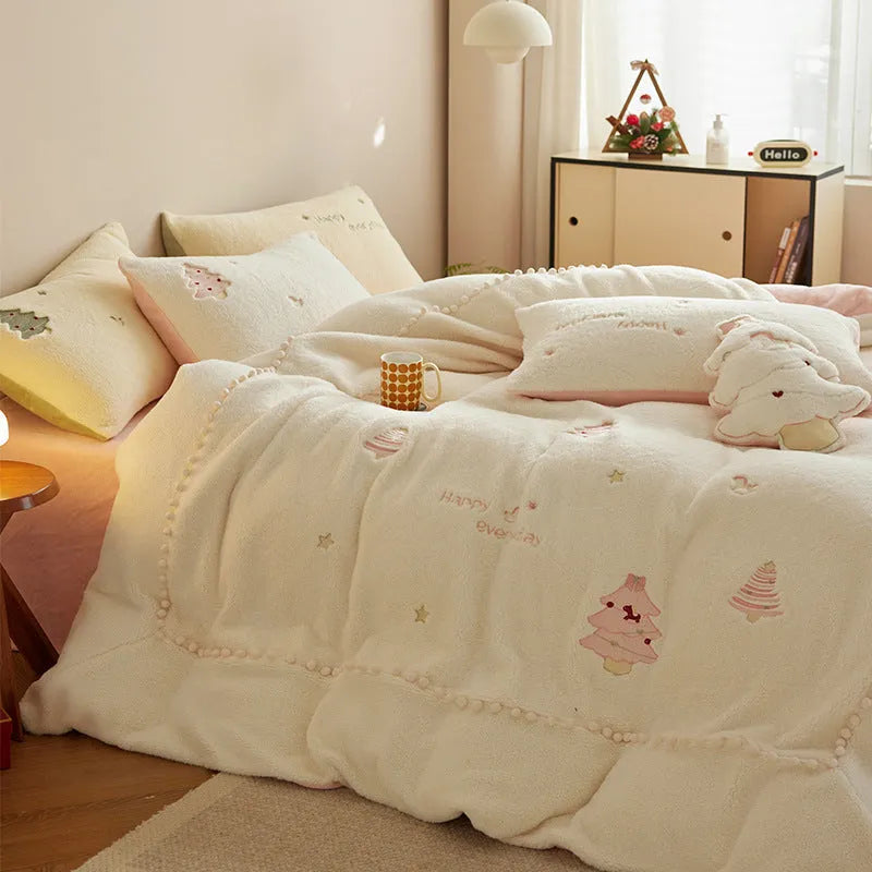 Winter milk fibre four-piece bedding set with green Christmas tree pattern on bed