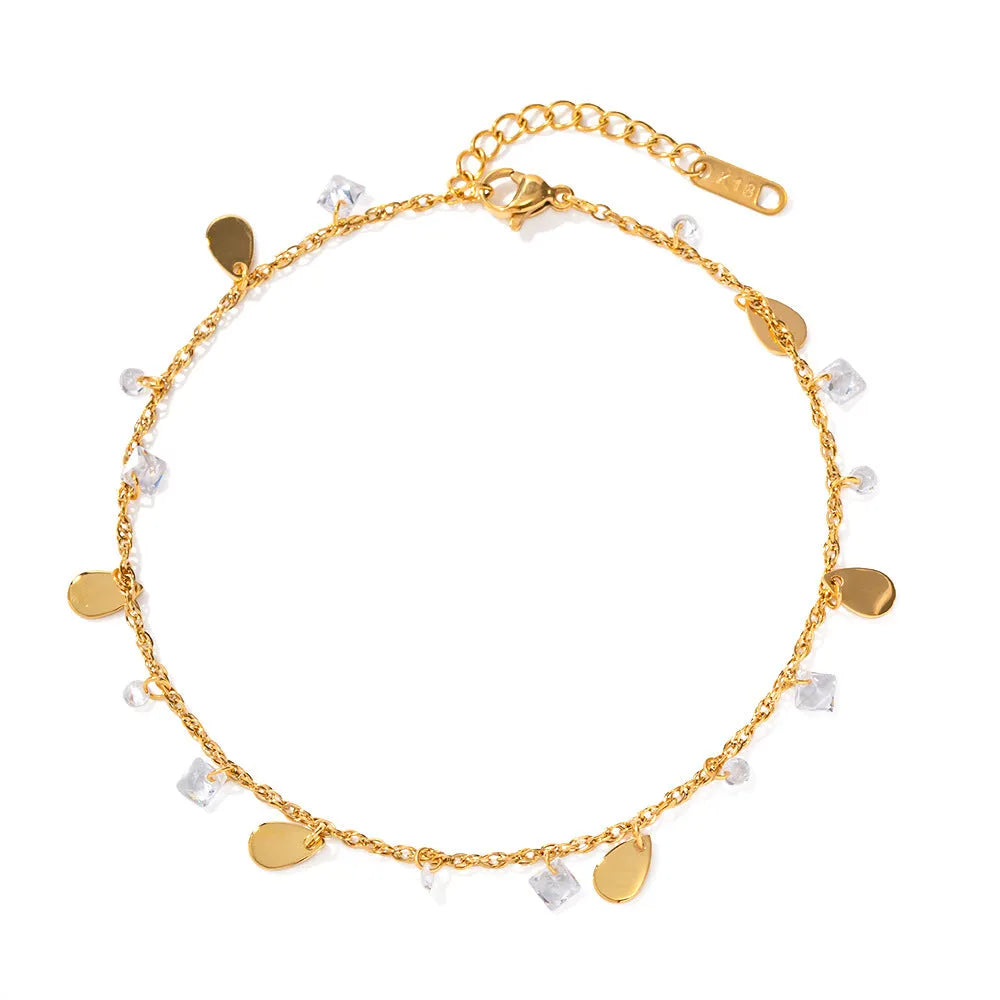 Stainless steel women's anklet with a water drop tassel charm and geometric details.