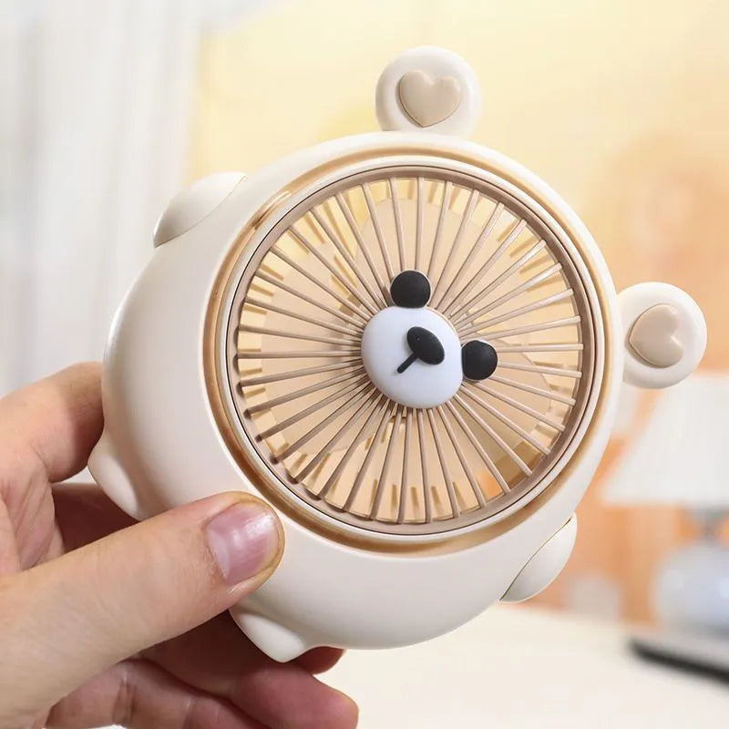 USB desk fan with bear and puppy design showing brown, apricot, and pink colour options.