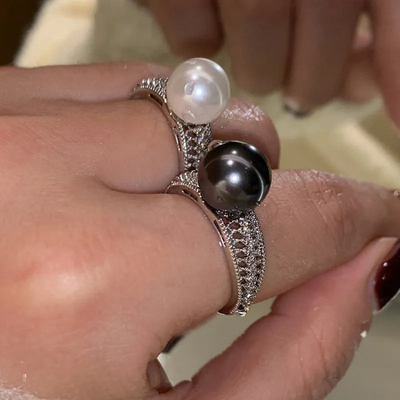 Geometric copper women's ring with adjustable opening and a black pearl detail.